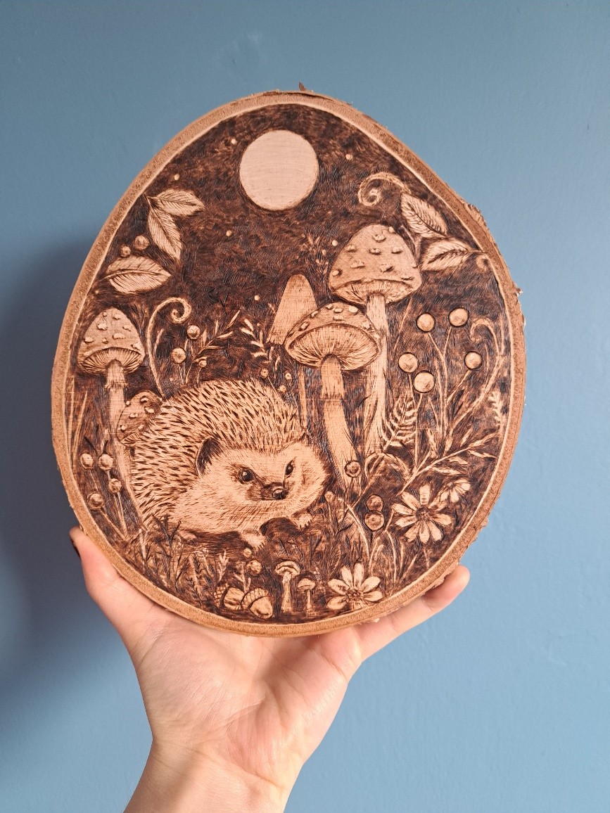 Hedgehog with mushrooms and moon on wood slice